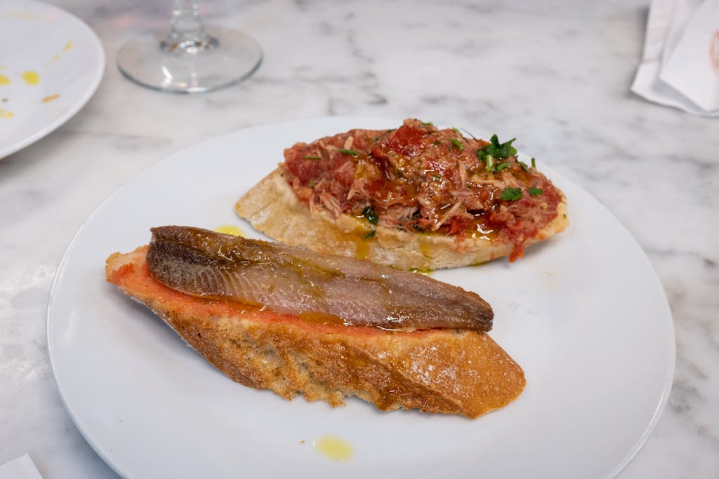 Savory Spanish tapas served on a white plate. Ideal for culinary content.